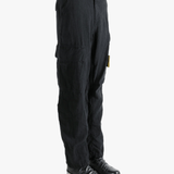 Black pants worn by a person, showing the pants fit