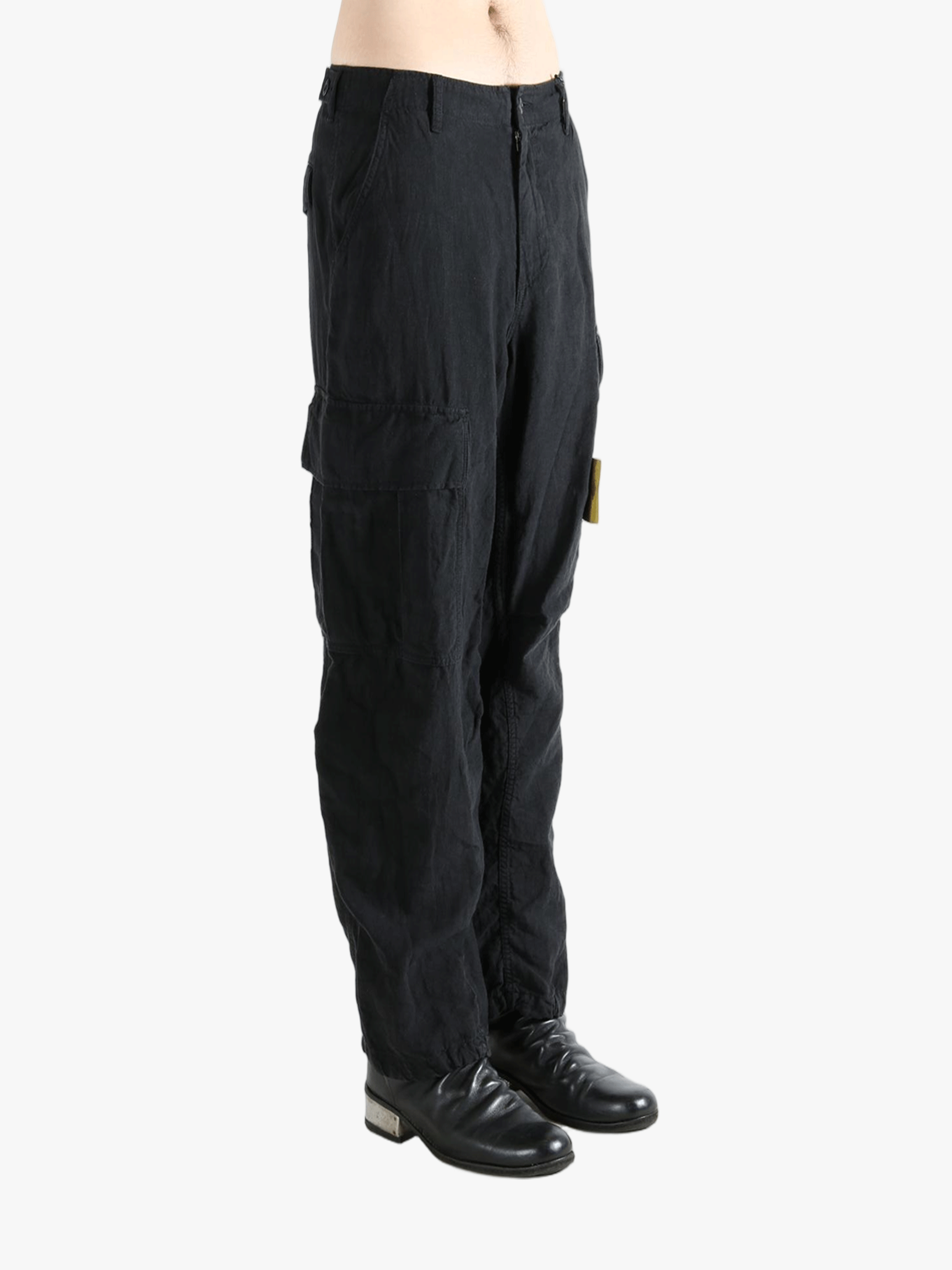 Black pants worn by a person, showing the pants fit
