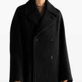 Black jacket worn by a person, showing the jacket fit