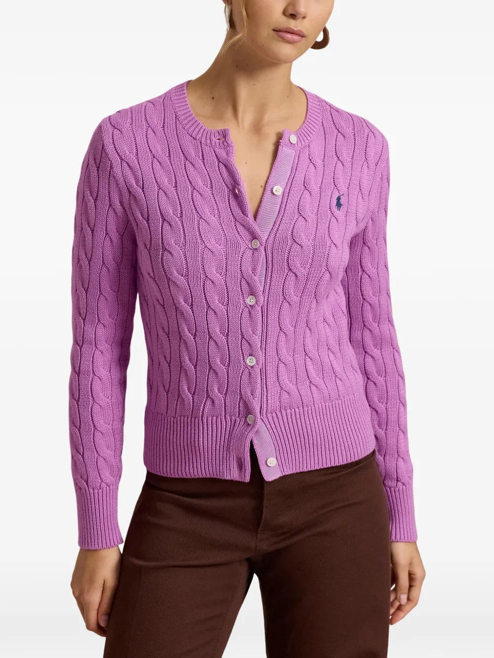 Purple knitwear worn by a person, showing the knitwear fit