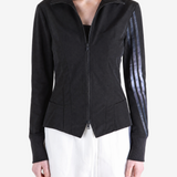 Black top worn by a person, showing the top fit
