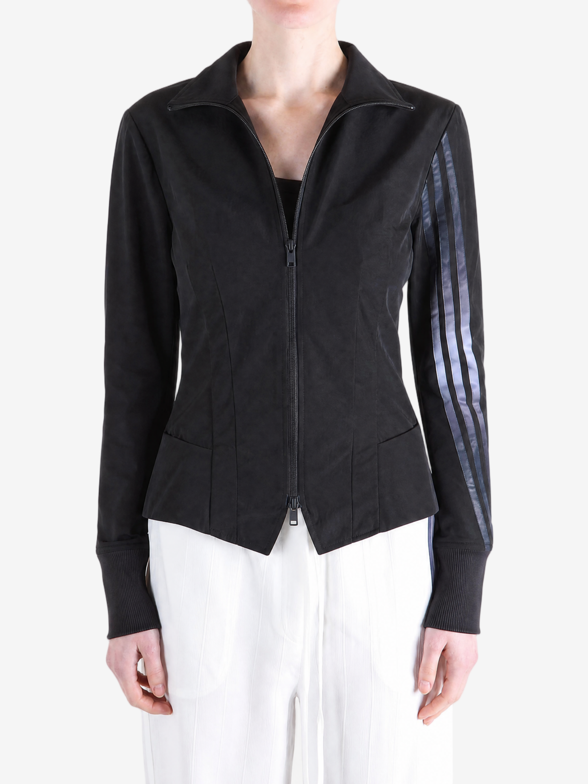 Black top worn by a person, showing the top fit
