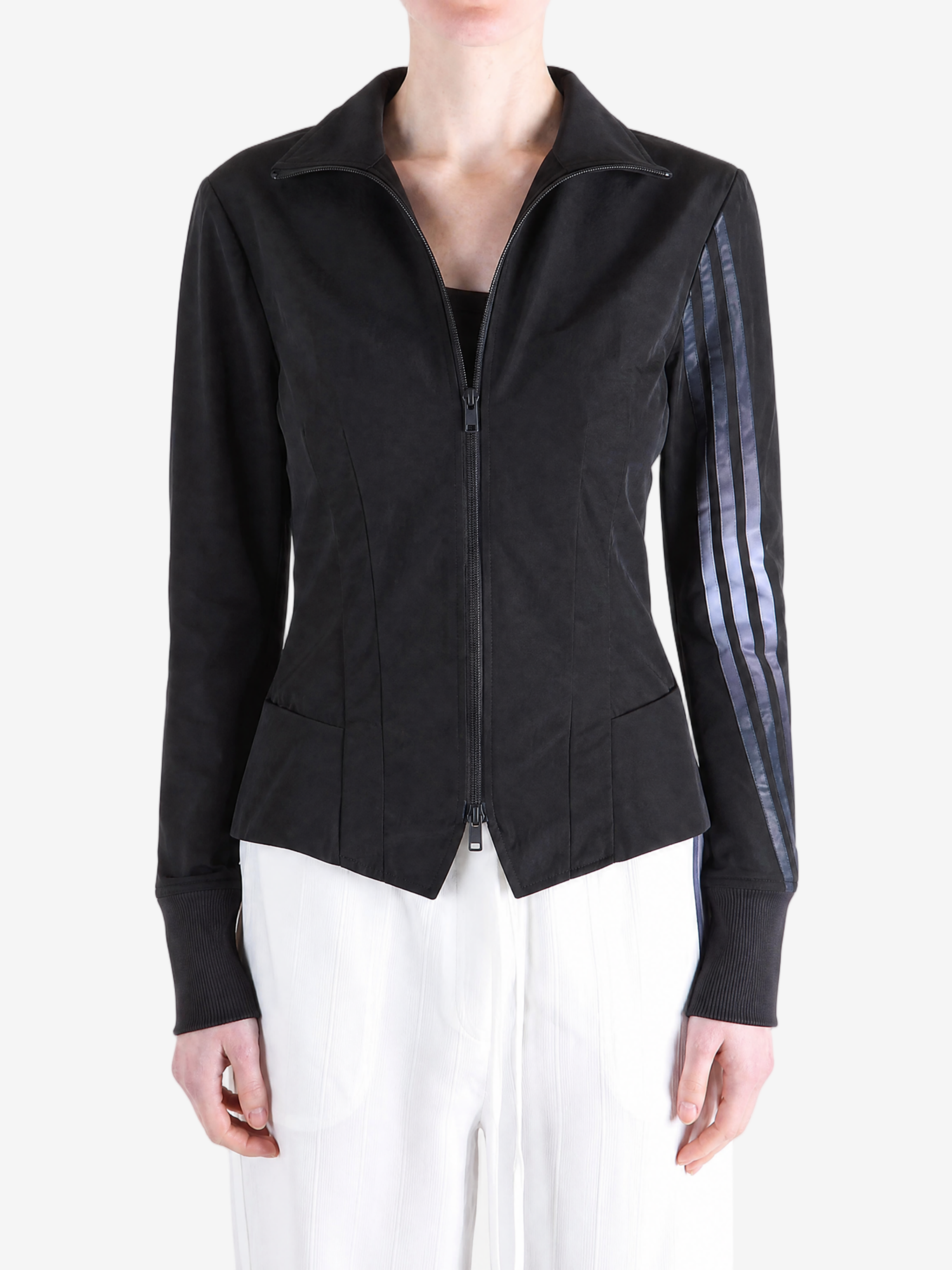 Black top worn by a person, showing the top fit