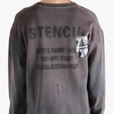 Grey top worn by a person, showing the top's fit