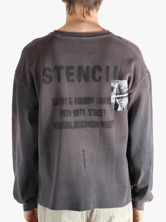 Grey top worn by a person, showing the top's fit