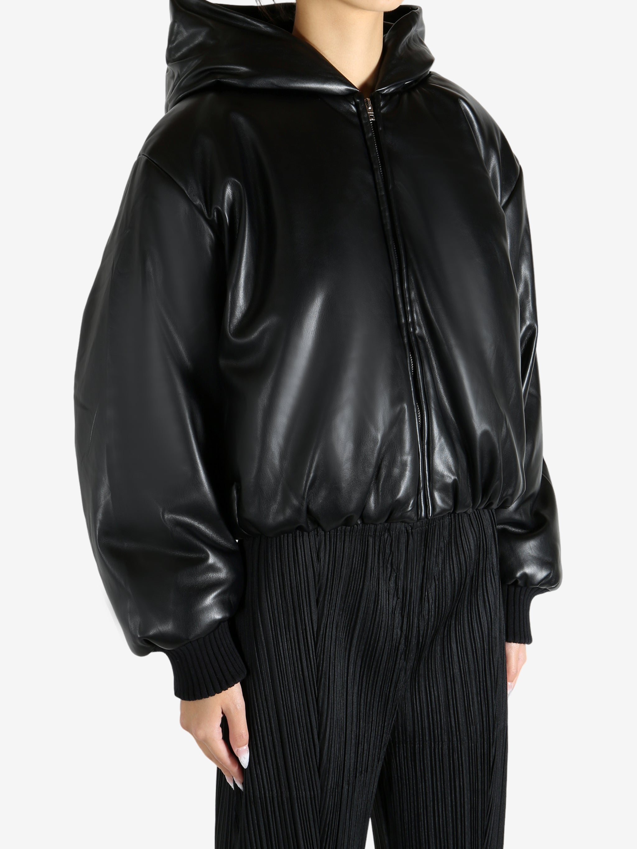 Black jacket worn by a person, showing the jacket's fit