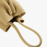 Close up of tan bags, showing texture of the fabric