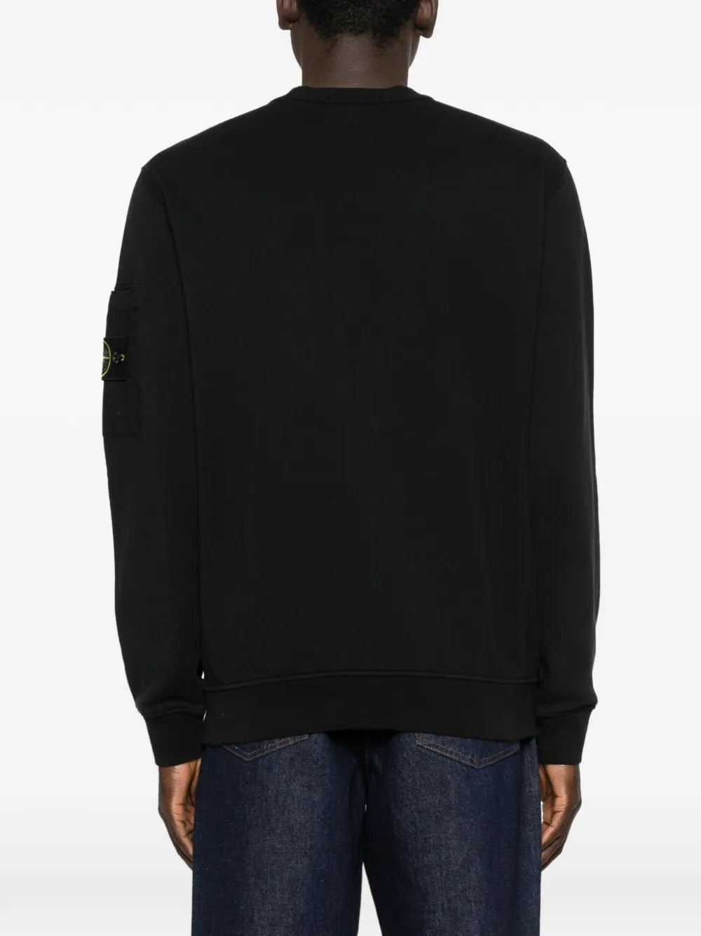 Black sweatshirt worn by a person, showing the sweatshirt fit