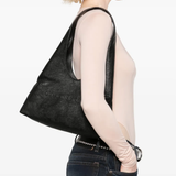 Black bag worn by a person,showing the bag fit