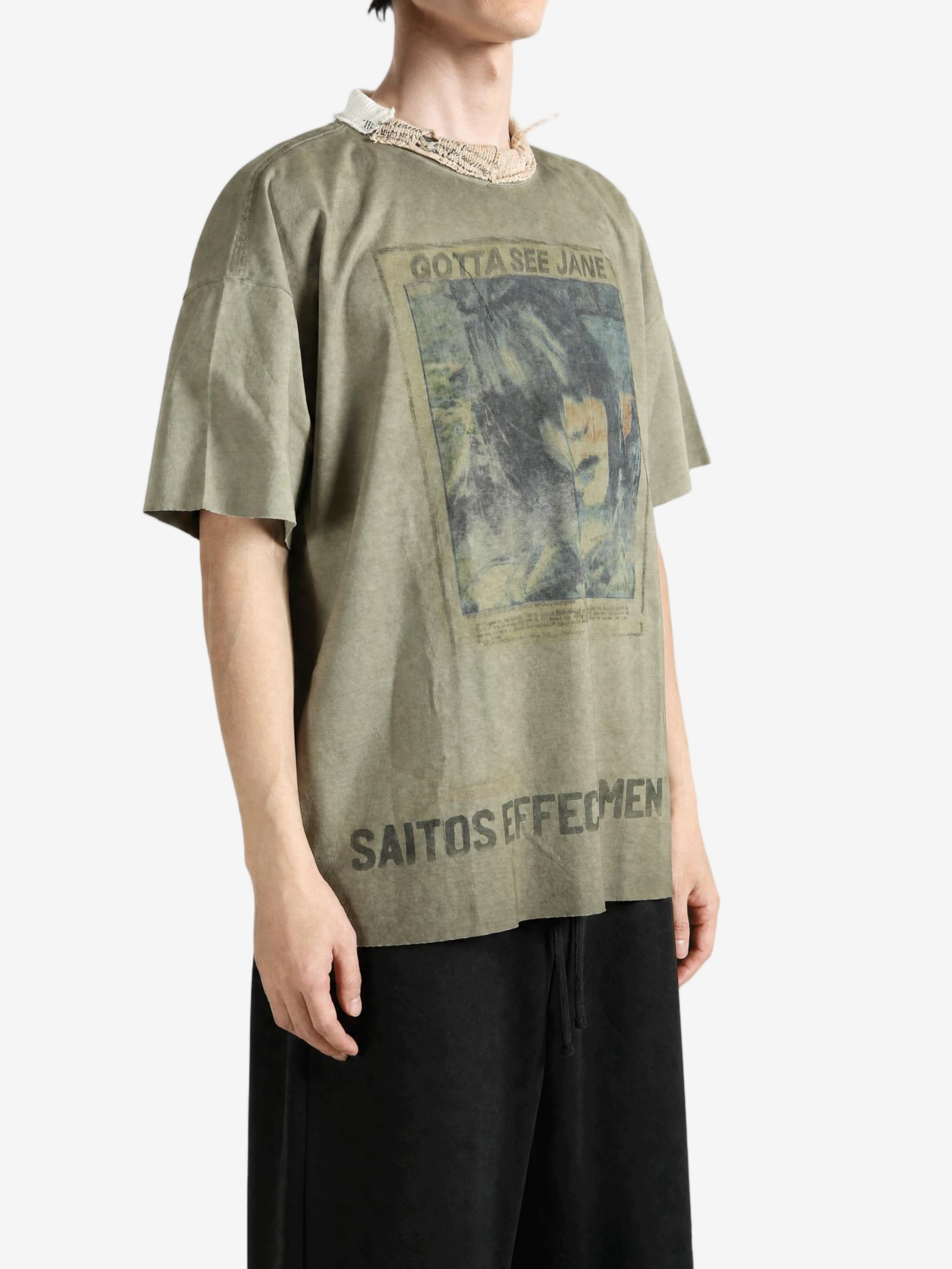 Green t-shirt worn by a person, showing the t-shirt fit