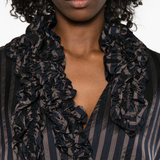 close up of black shirts, showing texture of the cupro fabric