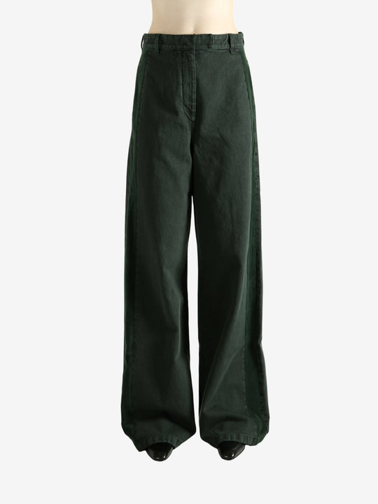 Green pants worn by a person, showing the pants's fit