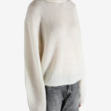 beige sweater worn by a person, showing the sweater fit