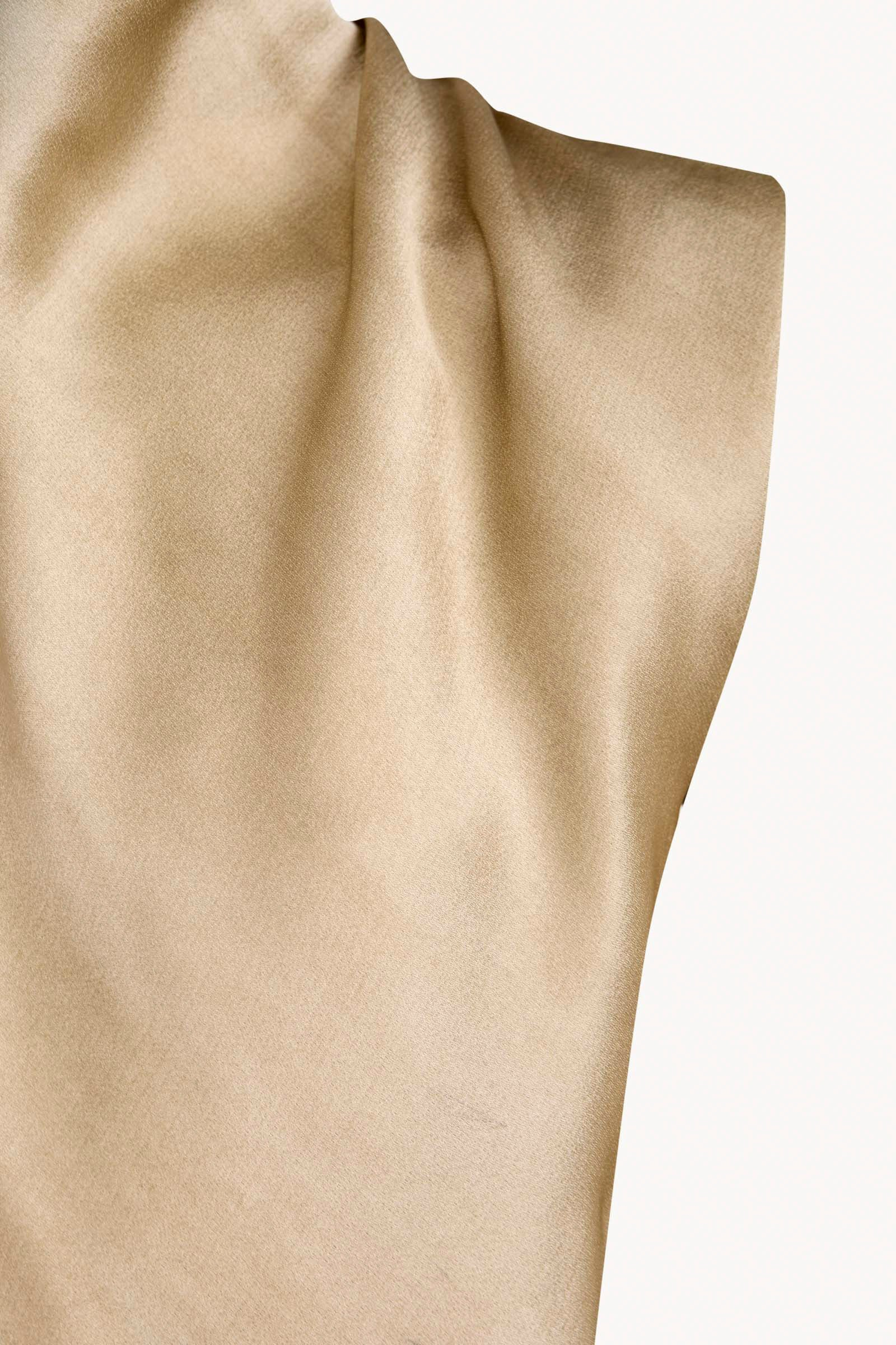 Close up of Tan top, showing texture of the 78% acetate/ 22% viscose fabric