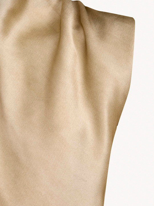Close up of Tan top, showing texture of the 78% acetate/ 22% viscose fabric