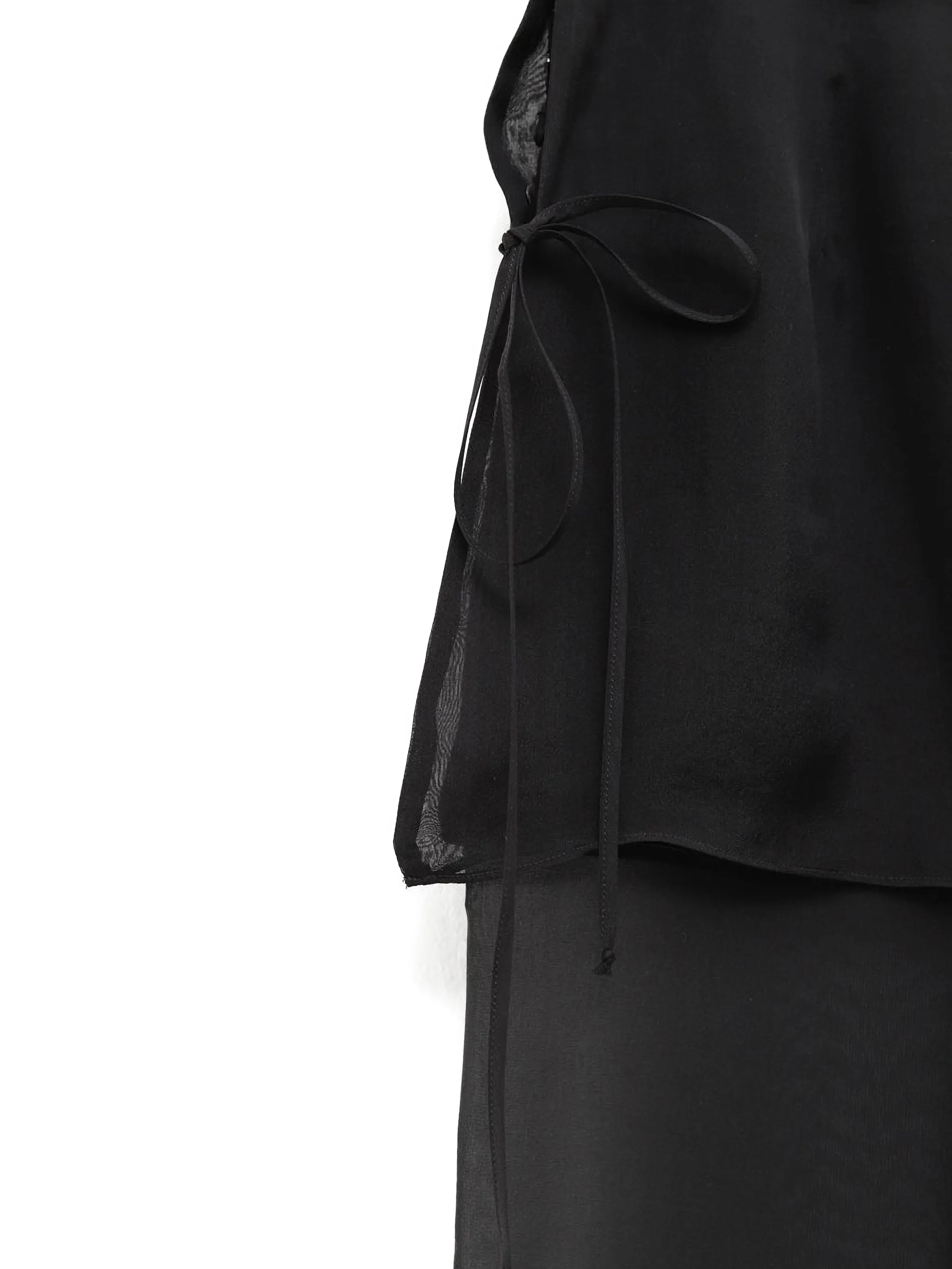Close up of black pants, showing texture of the silk fabric