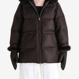 Brown jacket worn by a person, showing the jacket fit