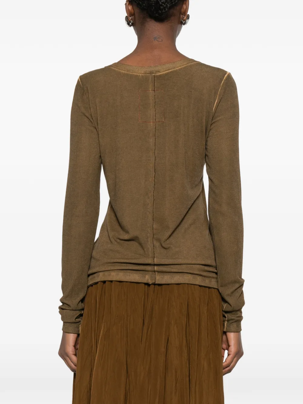 Brown tops worn by a person, showing the tops fit