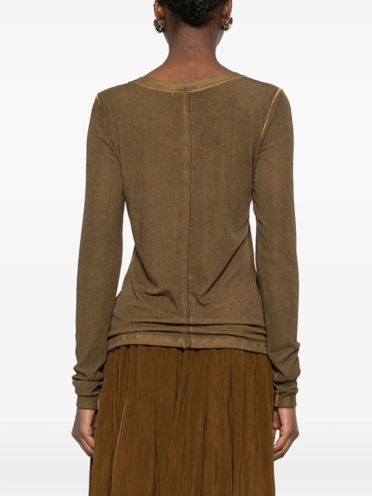 Brown tops worn by a person, showing the tops fit