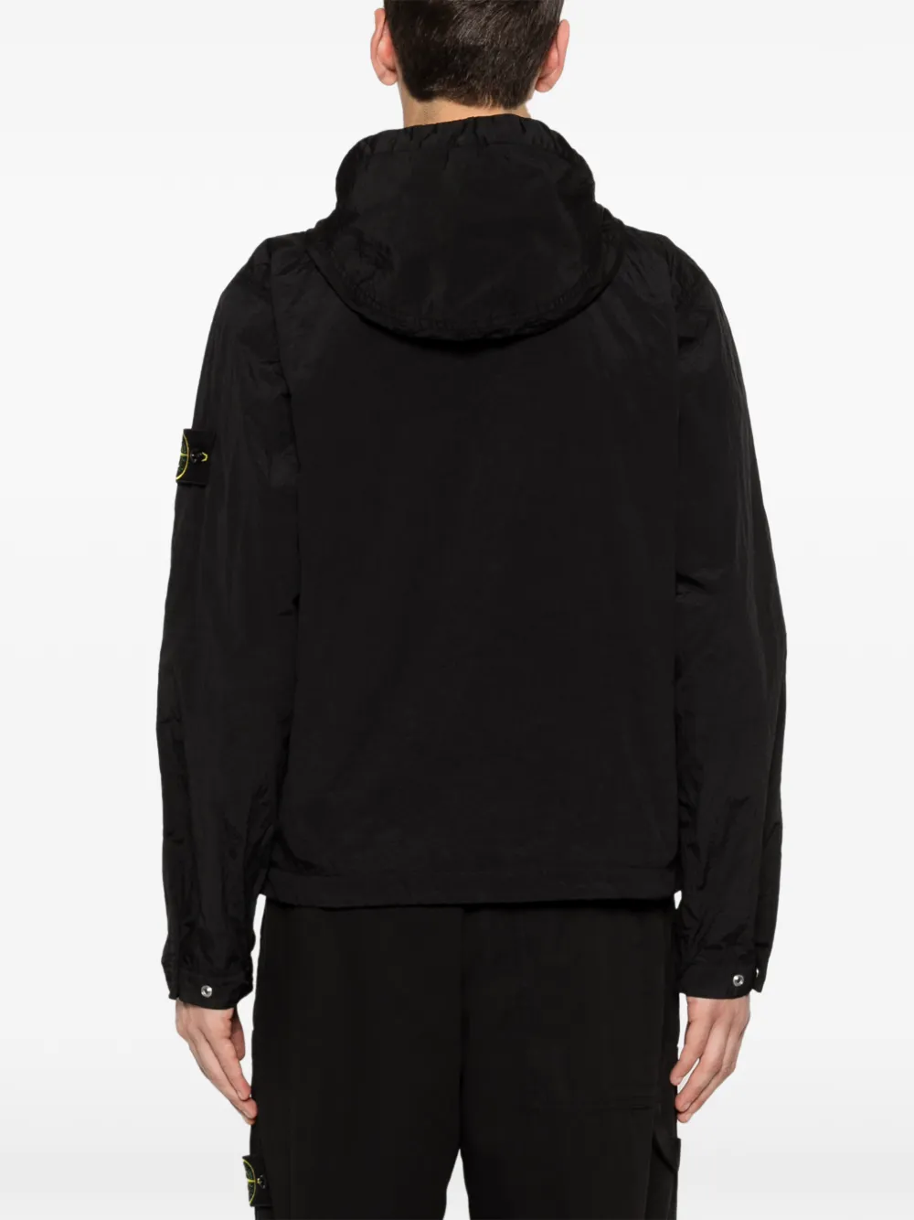 Black parka worn by a person, showing the parka's fit