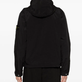 Black parka worn by a person, showing the parka's fit