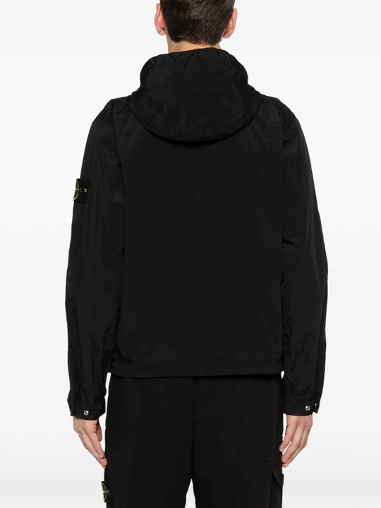 Black parka worn by a person, showing the parka's fit