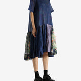 Navy dress worn by a person, showing the dress's fit