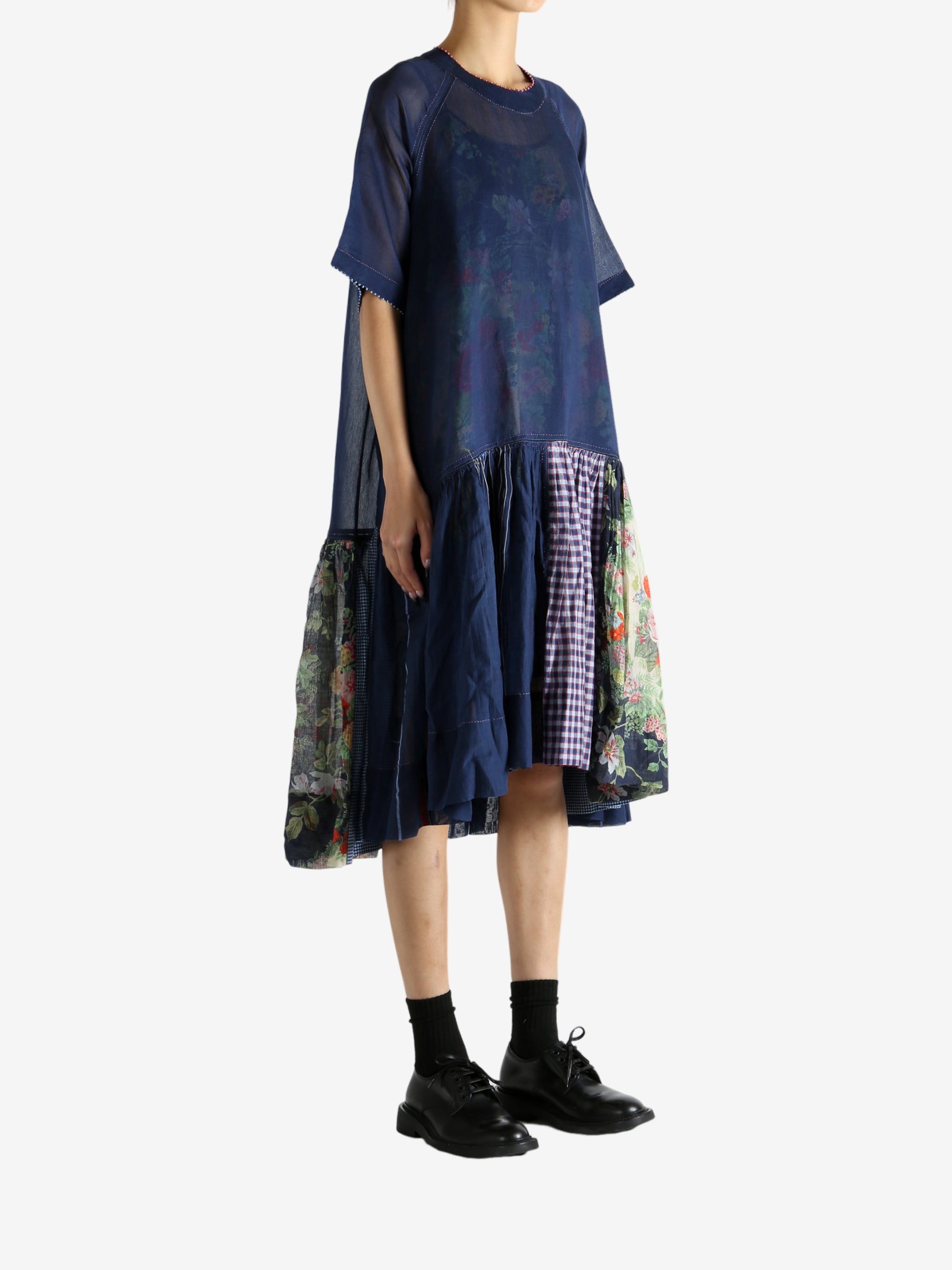 Navy dress worn by a person, showing the dress's fit