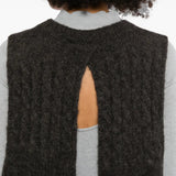 Brown scarf worn by a person, showing the scarf fit