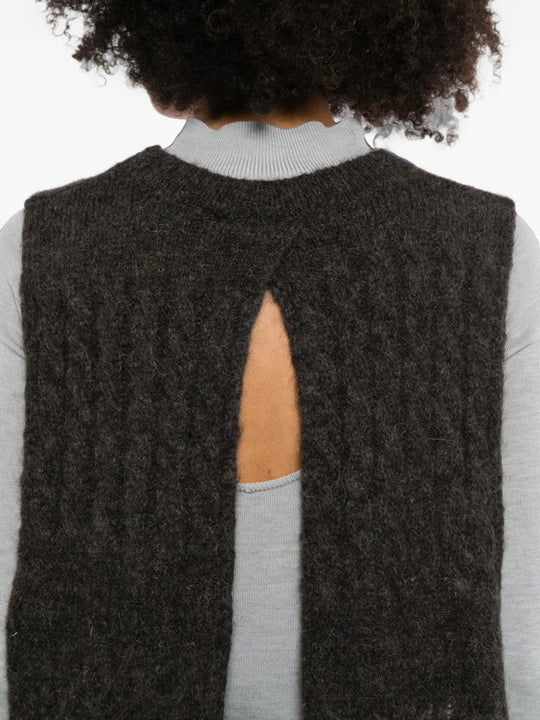 Brown scarf worn by a person, showing the scarf fit