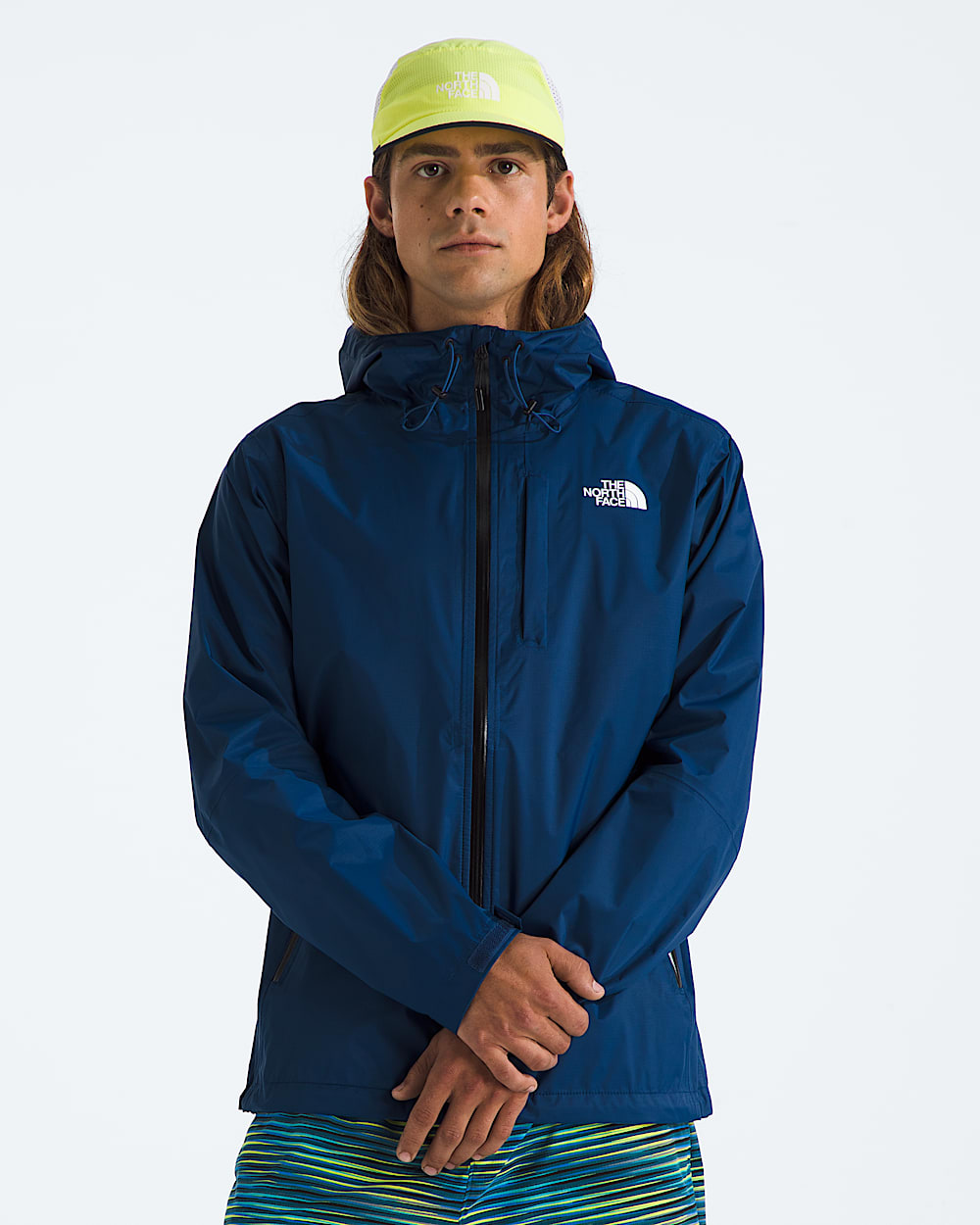 Blue jacket worn by a person, showing the jacket fit