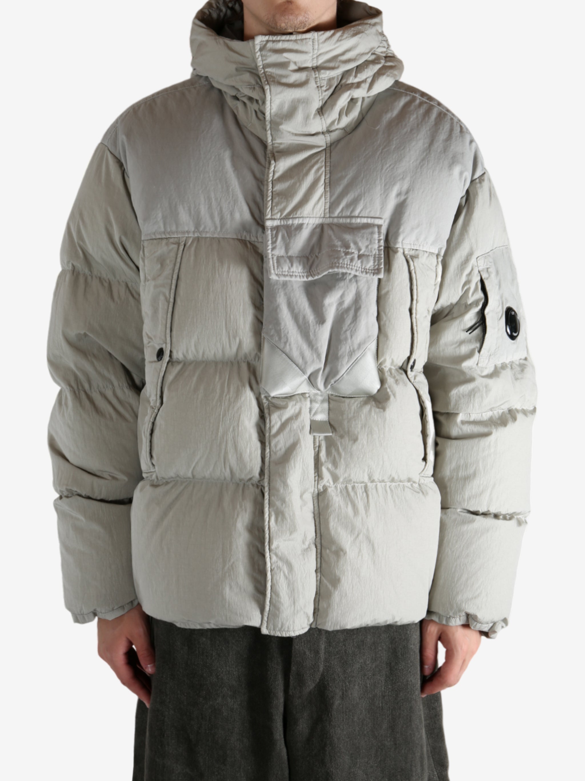 Grey jacket worn by a person, showing the jacket's fit