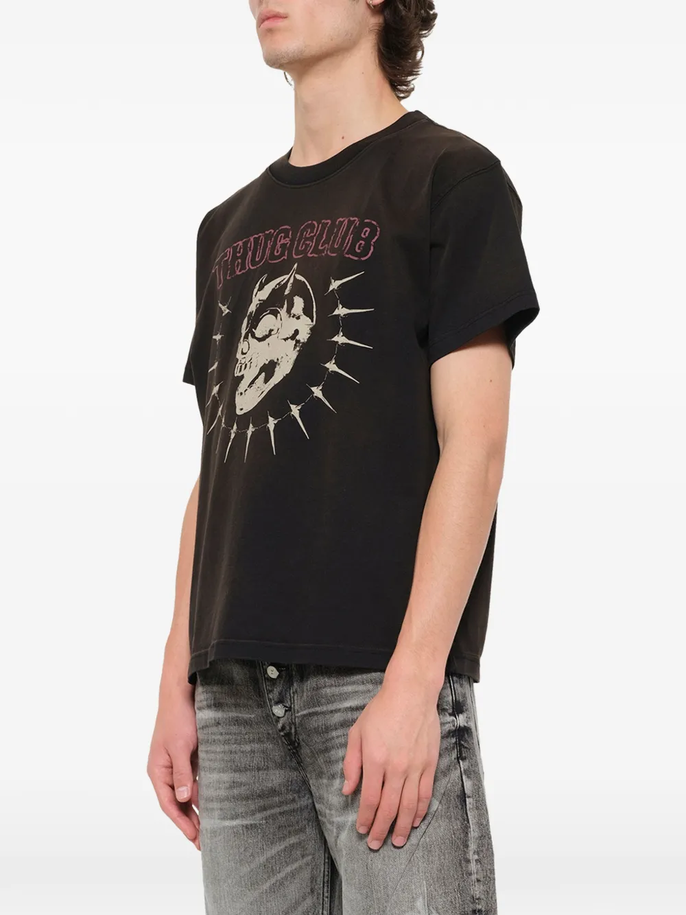 Black t-shirt worn by a person, showing the t-shirt fit