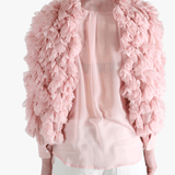 Pink blouse worn by a person, showing the blouse fit