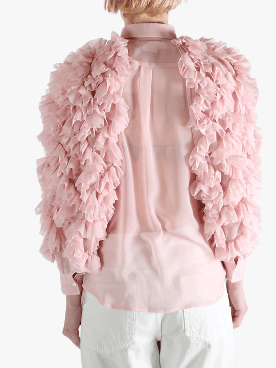 Pink blouse worn by a person, showing the blouse fit