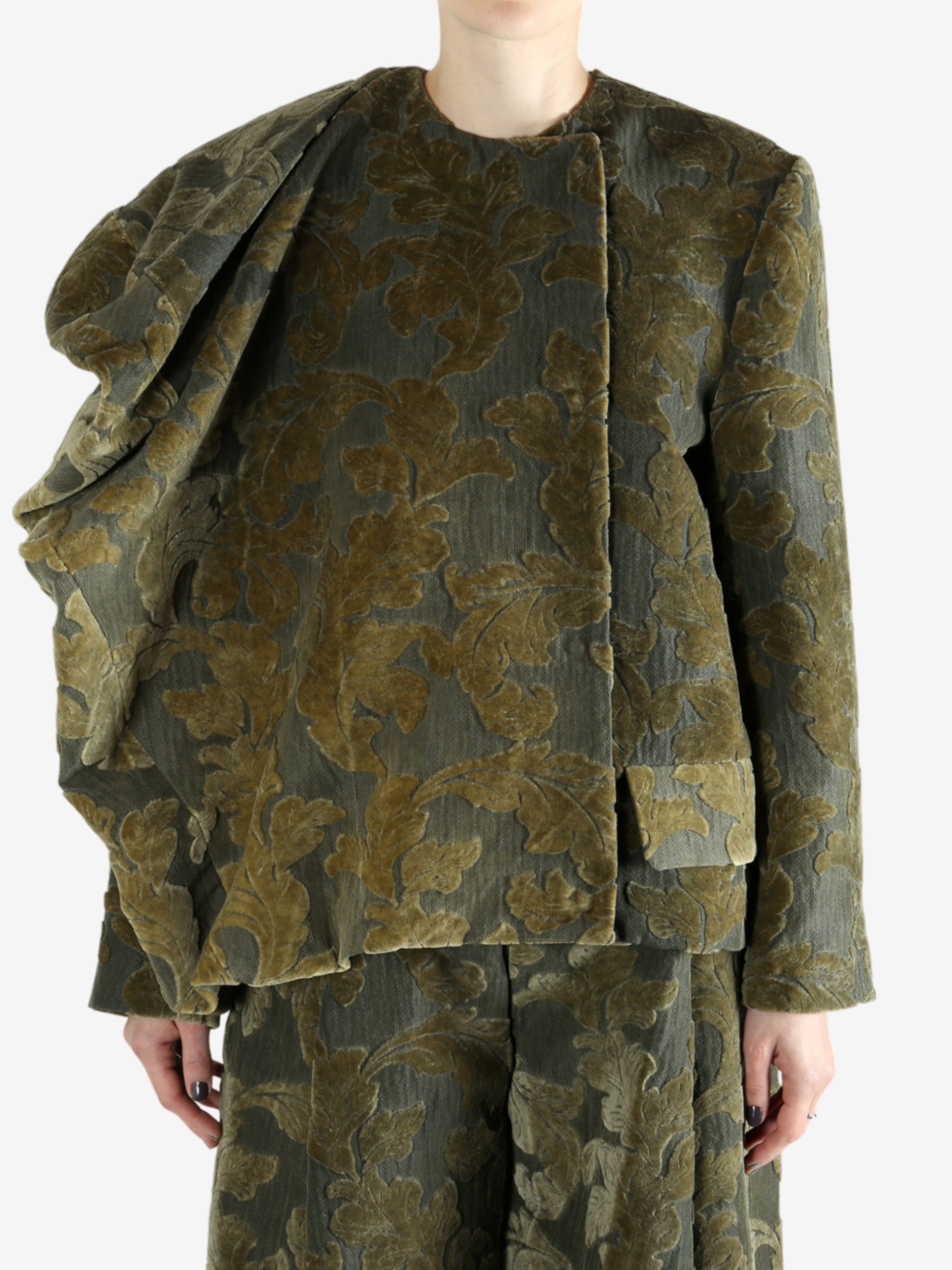 Grey jacket worn by a person, showing the jacket's fit