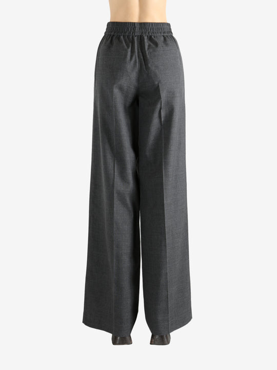 Grey pants worn by a person, showing the pants fit