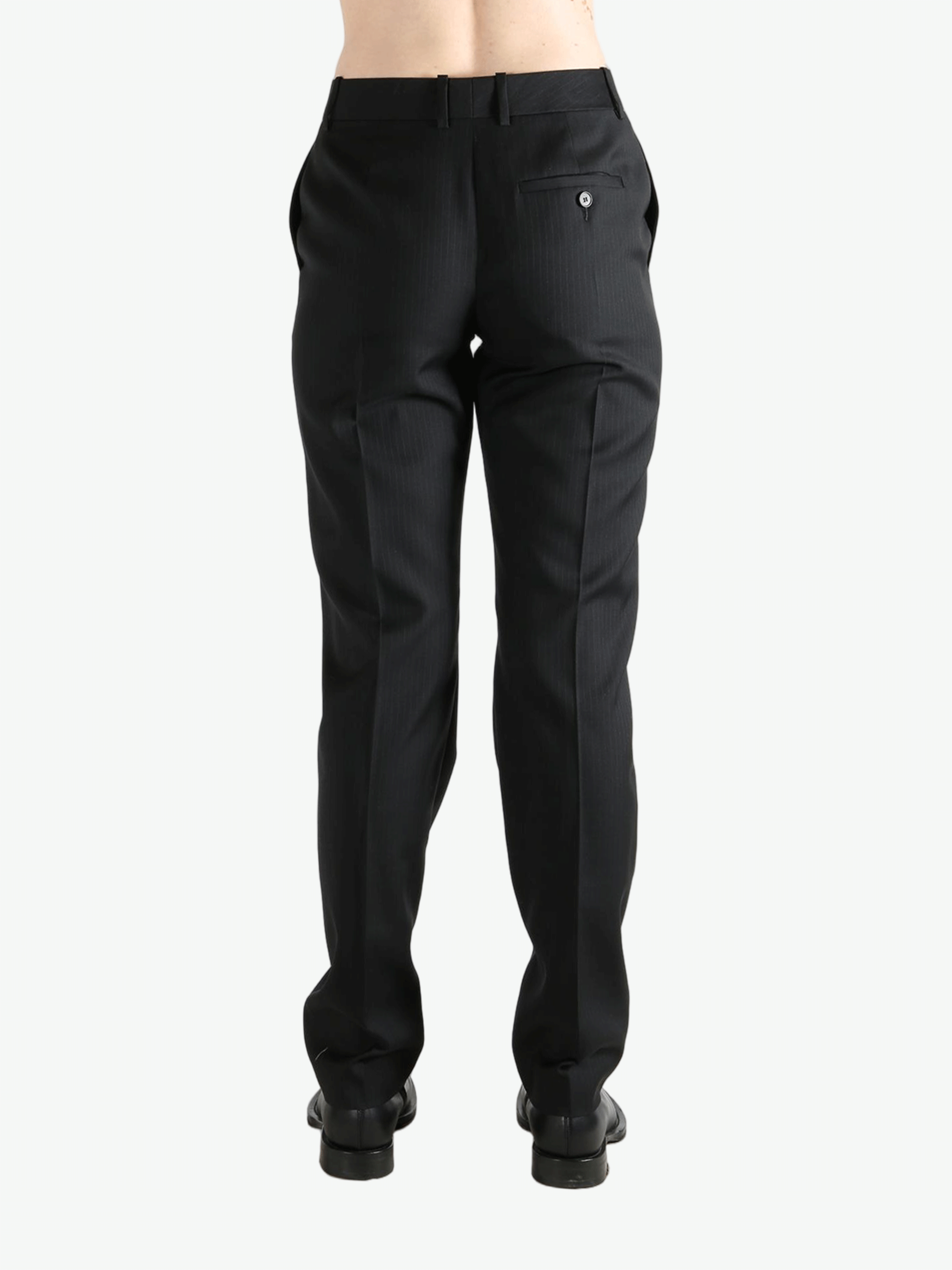 Grey pant worn by a person, showing the pant's fit