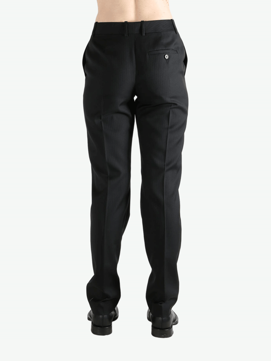 Grey pant worn by a person, showing the pant's fit