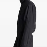 Black jacket worn by a person, showing the jacket's fit