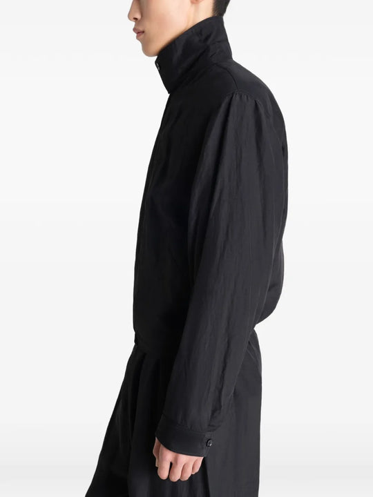 Black jacket worn by a person, showing the jacket's fit