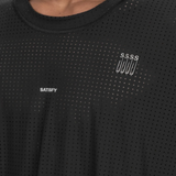 Close up of Black t-shirt, showing texture of the 73% nylon/ 27% elastane fabric