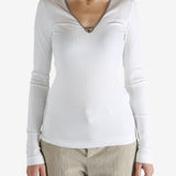 White tops worn by a person, showing the tops fit