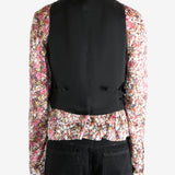 Black top worn by a person, showing the top's fit