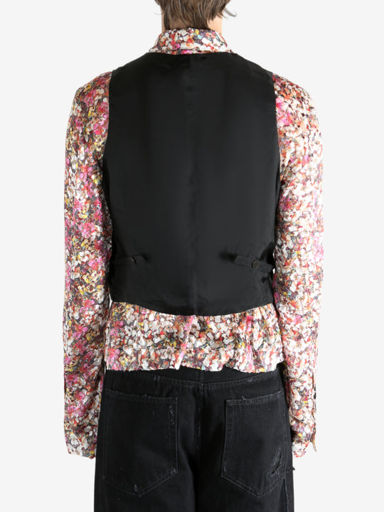 Black top worn by a person, showing the top's fit