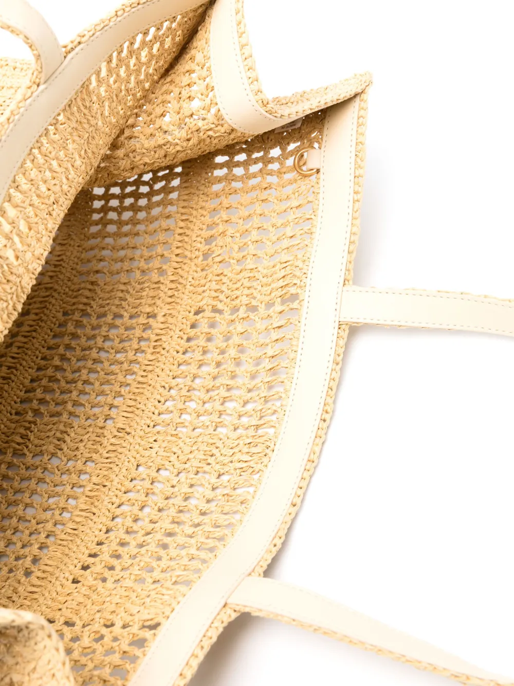 Close up of tan bags,showing texture of the straw fabric.
