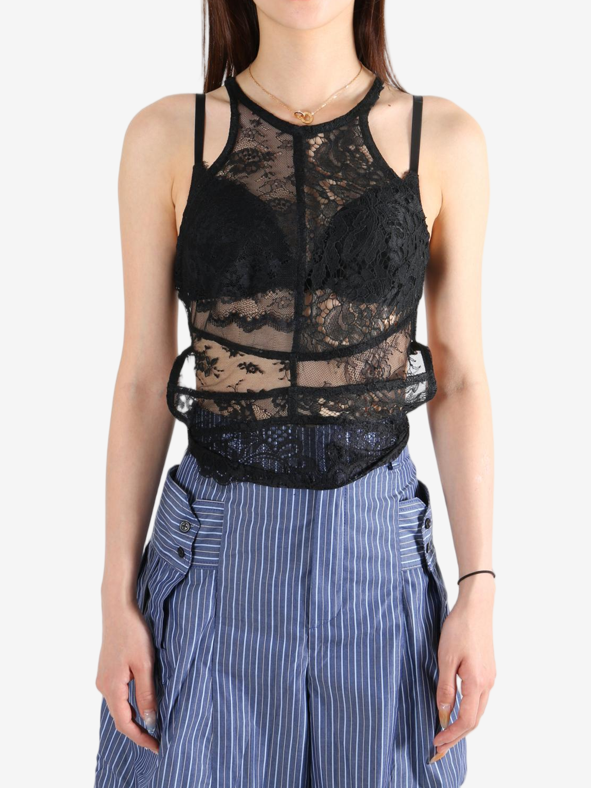 Black top worn by a person, showing the top's fit