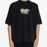 Black t-shirt worn by a person, showing the shirt's fit