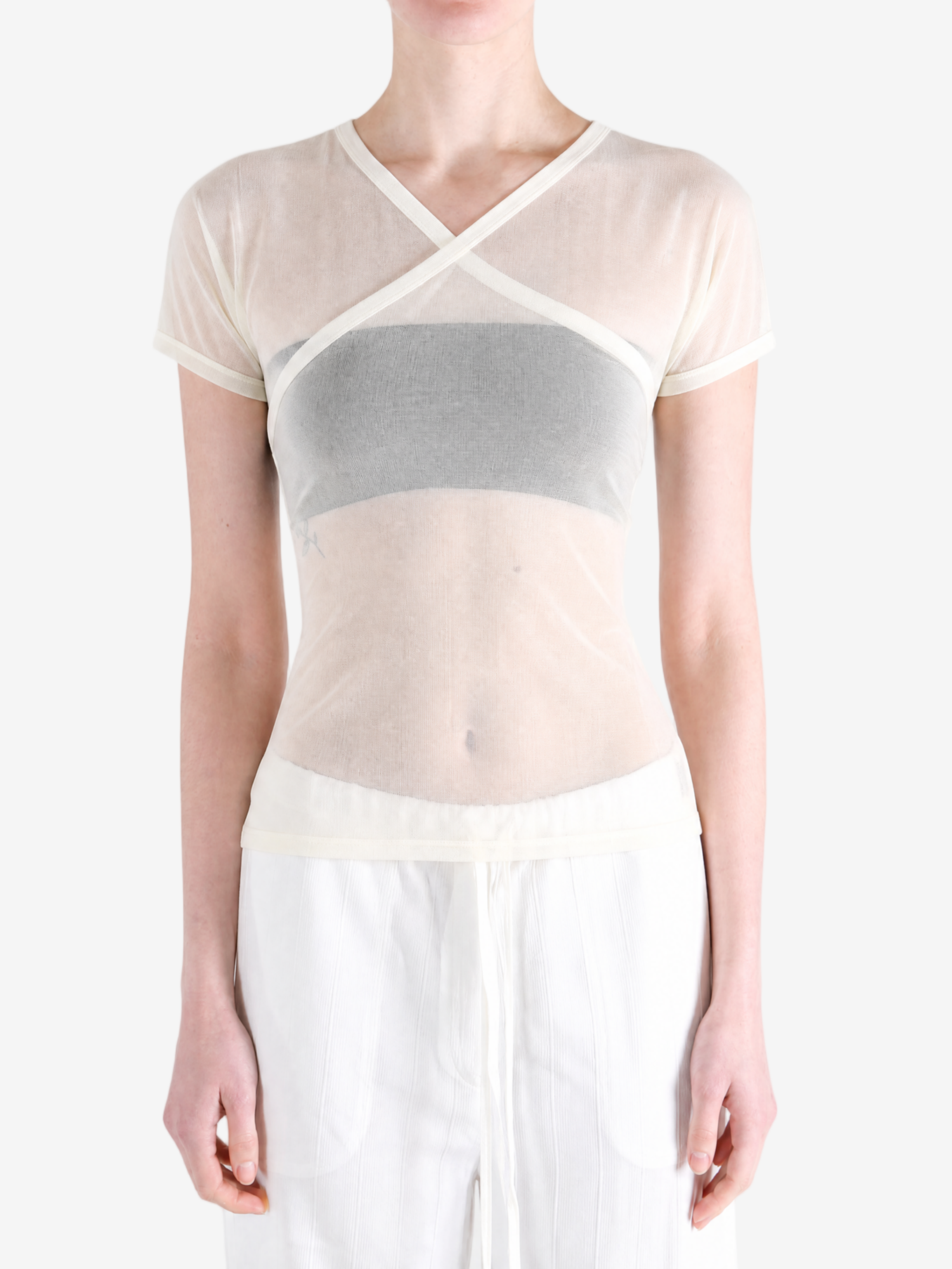 Tan top worn by a person, showing the top fit