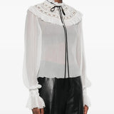 White top worn by a person, showing the top fit